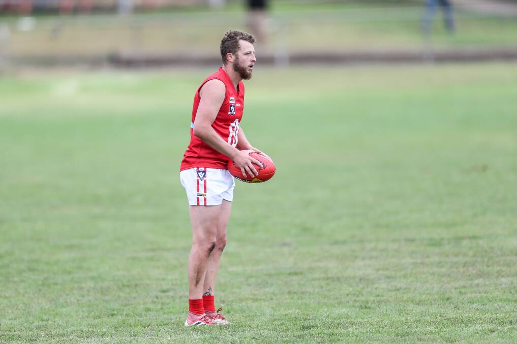 A big milestone: Dennington wingman Luke Pearson prepares to kick the ball. He will play his 150th match for the club on Saturday against Merrivale. Picture: Christine Ansorge