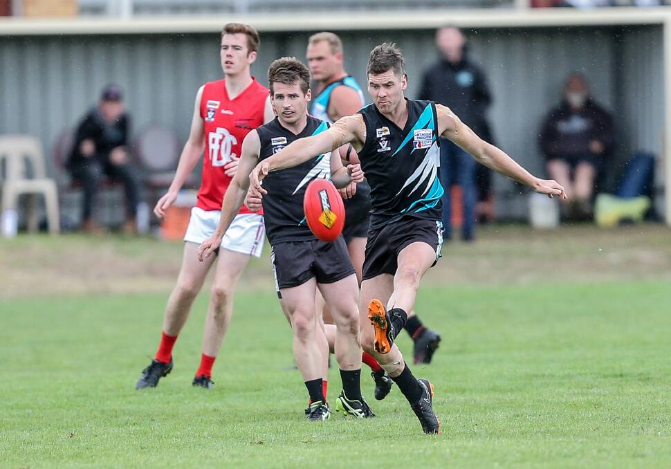 FROM THE BACK: Kolora-Noorat's Nick Bourke kicks the ball down the ground. Picture: Christine Ansorge