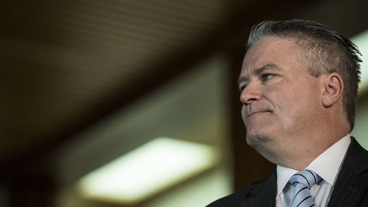 Finance Minister Mathias Cormann speaks to the media at Parliament House in Canberra on Monday.