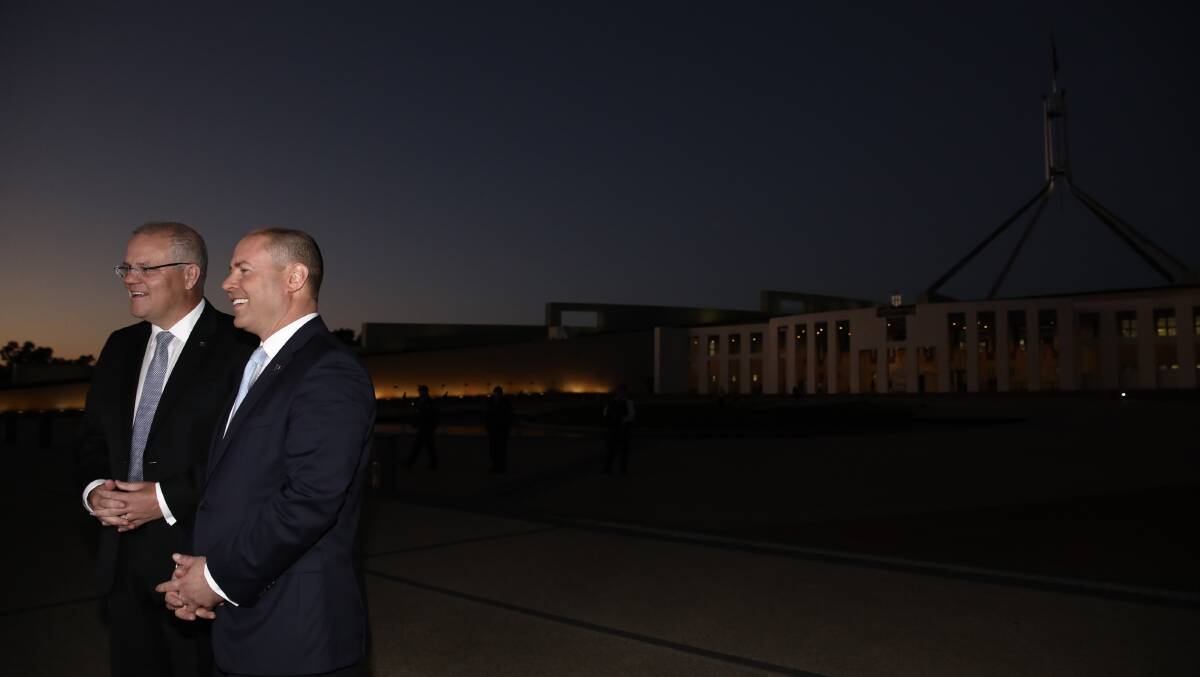 Prime Minister Scott Morrison and Treasurer Josh Frydenberg have post budget interviews on the front  lawns at Parliament House in Canberra on Wednesday. Photo: Dominic Lorrimer