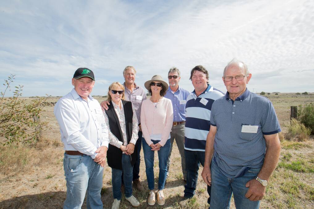 Long wait: Landholders Vincent Gedye, Karen Blackmore, Bill Blackmore, Leanne Lamont, Andrew Lamont, Will Lynch and Don Kosch celebrate the start of the Dundonnell wind farm projectPicture: Christine Ansorge