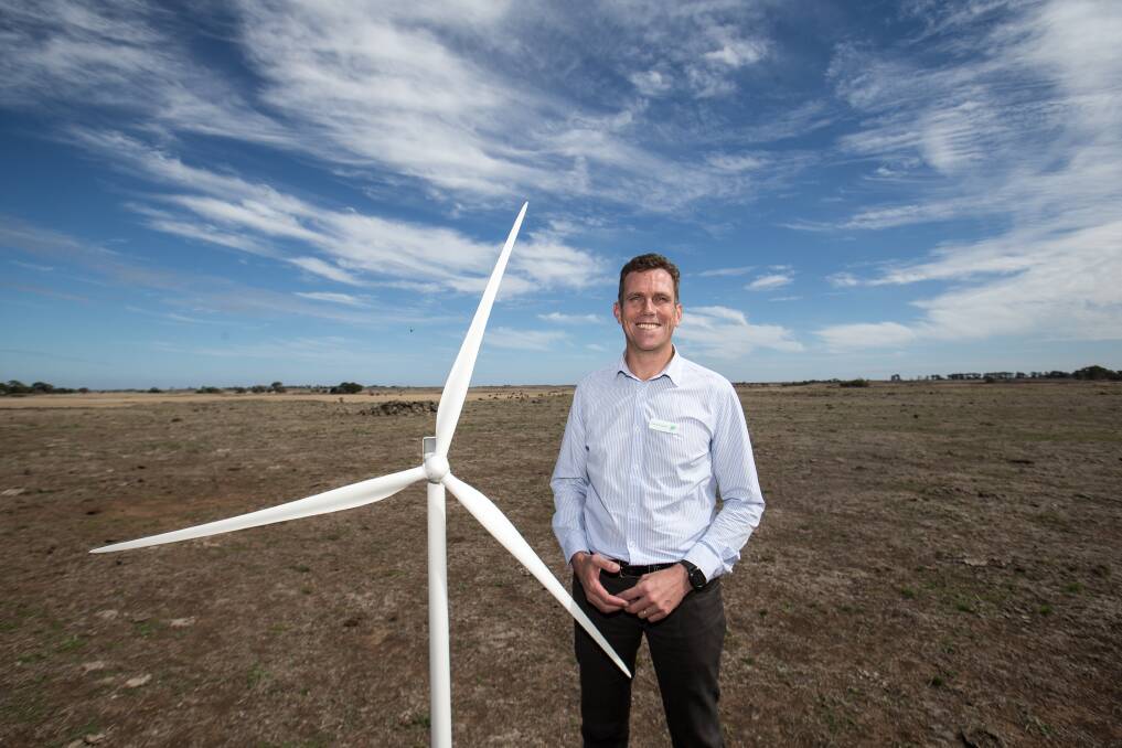 Blue skies ahead: Tilt Renewables cheif executive Deion Campbell with a model of a Vestas wind turbine.  Picture: Christine Ansorge