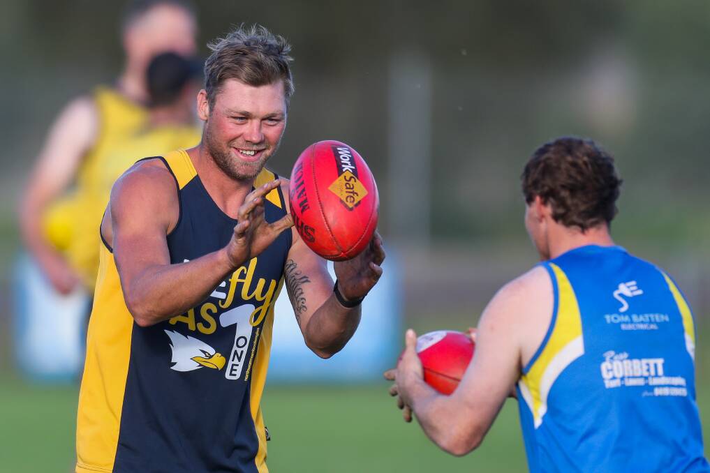 EARNING HIS WINGS: North Warrnambool Eagles recruit Justin Wallace is all smiles at training on Thursday night ahead of his club debut on Saturday. Picture: Morgan Hancock