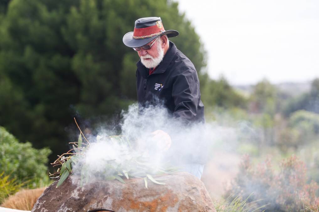 Robert Lowe Senior conducts a traditional smoking ceremony at the event. Picture: Morgan Hancock