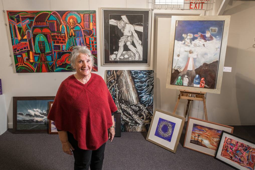Exhibition: Easter Arts Festival organiser Jenny Arms with some of the Easter-themed works which are currently on show at Warrnambool's Merri View Gallery. Picture: Christine Ansorge