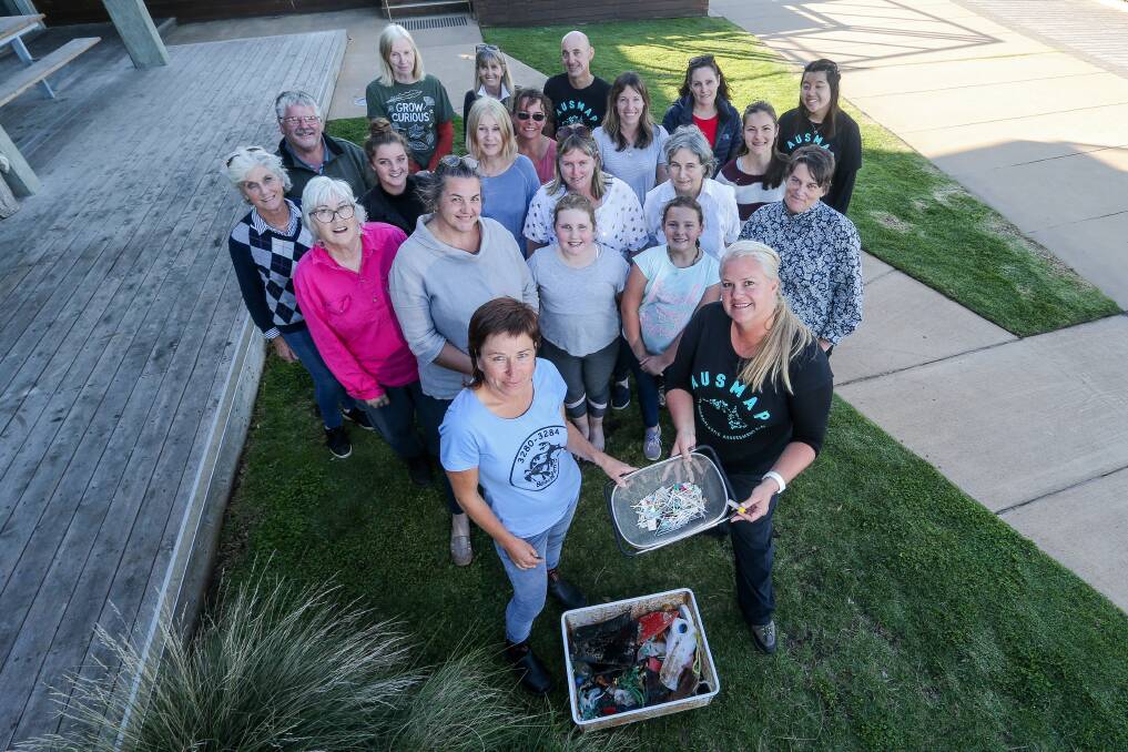 GREAT JOB: Warrnambool environmentalist Colleen Hughson and Sydney scientist Dr Michelle Blewitt hold plastic found along the beach with workshop attendees. Picture: Anthony Brady