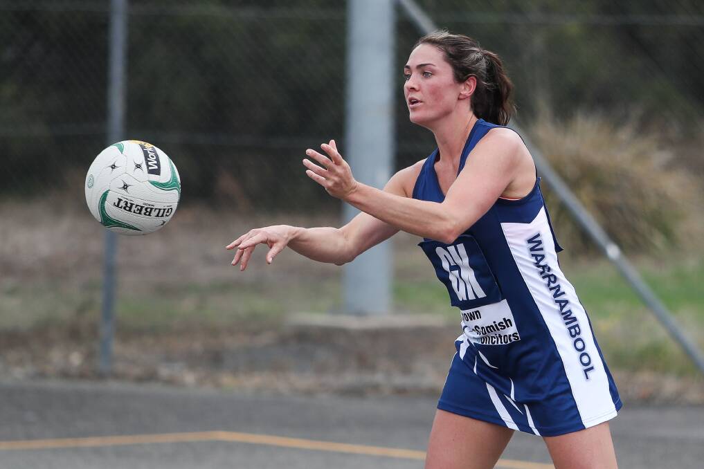 SETTLING IN: Warrnambool's Emma Cust brings the ball out of defence against Terang Mortlake on Saturday. Picture: Morgan Hancock