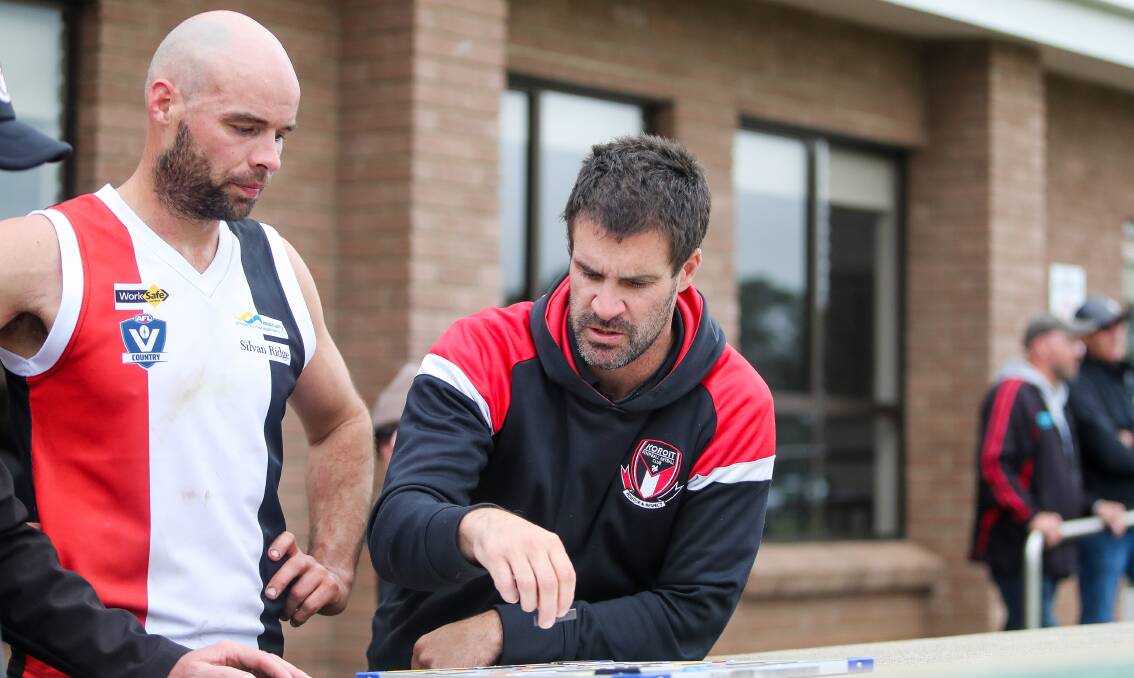 MOVING THE MAGNETS: Koroit coach Chris McLaren discussing tactics with assistant coach Damian O'Connor. Picture: Morgan Hancock