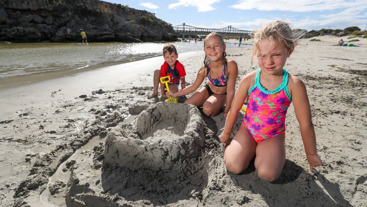 Autumn sun: Port Fairy's Lucas Resk Wilson, 5, Sofia Resk Wilson, 8, and Julia Resk Wilson, 5, enjoy some April beach time building sandcastles in the sun at Stingray Bay as the temperature climbs into the 30's. Picture: Rob Gunstone 
