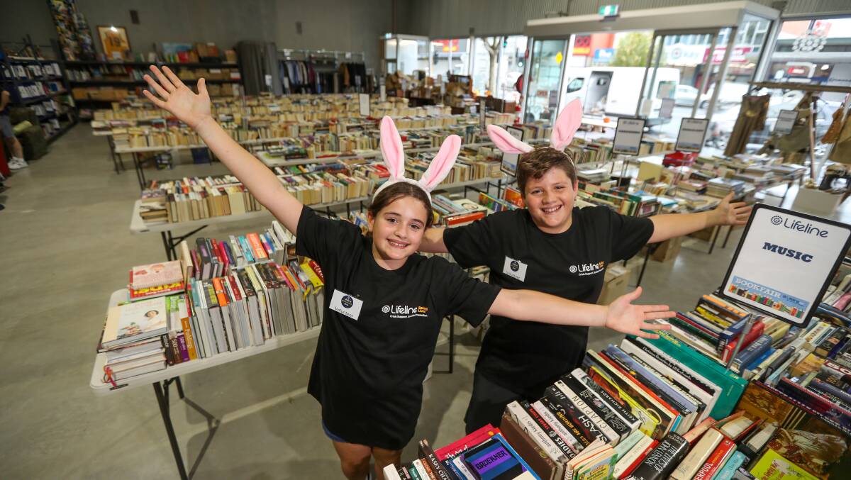 Page turner: Twins Ianthe and Alexander Verginis, 11, of Essendon, enjoy the Lifeline Easter Book Fair during their visit to Warrnambool for the school holidays. Picture: Rob Gunstone