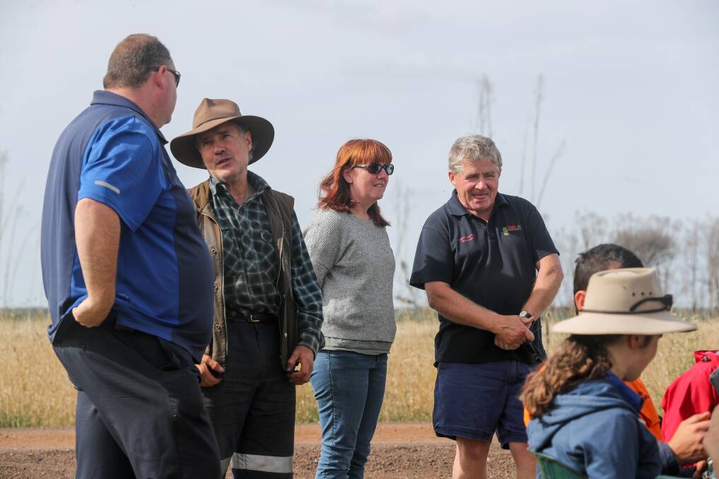 Farmers Angus McGillivery and Jack Kenna talk with CFA staff at the recovery van. Picture: Rob Gunstone