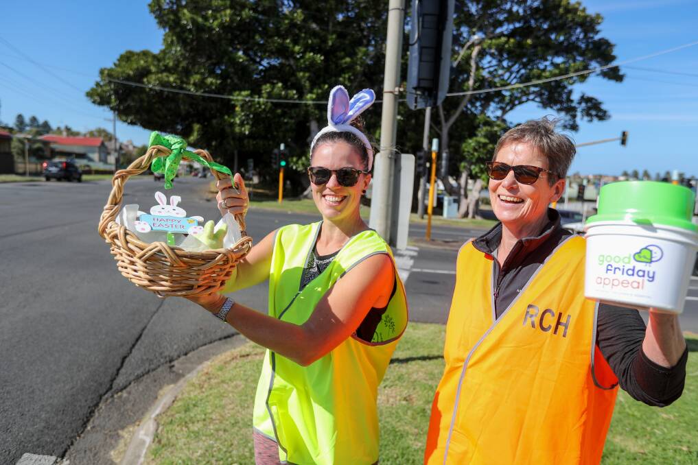 ALL SMILES: Highway collectors Ebony Gruar and Helene Plummer had treats for drivers who donated to the Good Friday Appeal. Picture: Rob Gunstone