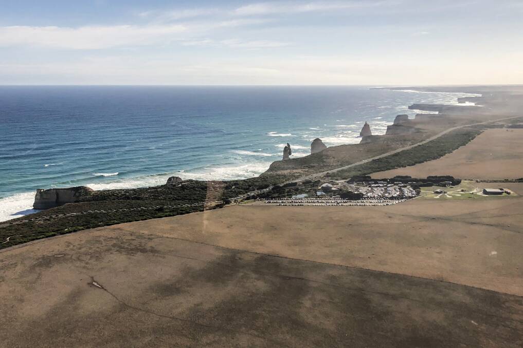 Crowds: A view of the traffic congestion caused by the number of tourists visiting the Twelve Apostles at Port Campbell. 