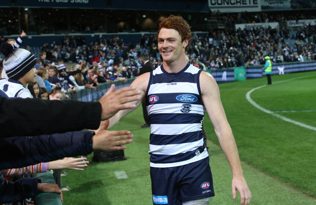 Happy days: Cobden export Gary Rohan celebrates after the Cats win over the Eagles on Sunday. Picture: AAP/David Crosling