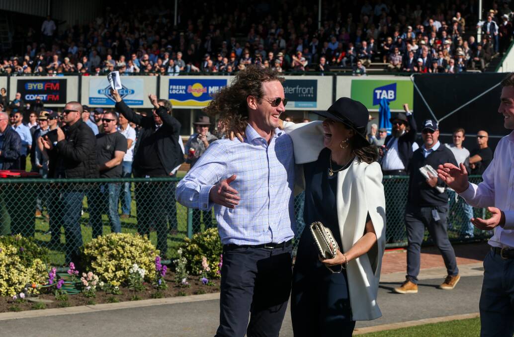 PROUD AS PUNCH: Trainers Ciaron Maher and Annabel Neasham watch the closing stages of the Galleywood Hurdle, as Big Blue comes home to win. Picture: Rob Gunstone