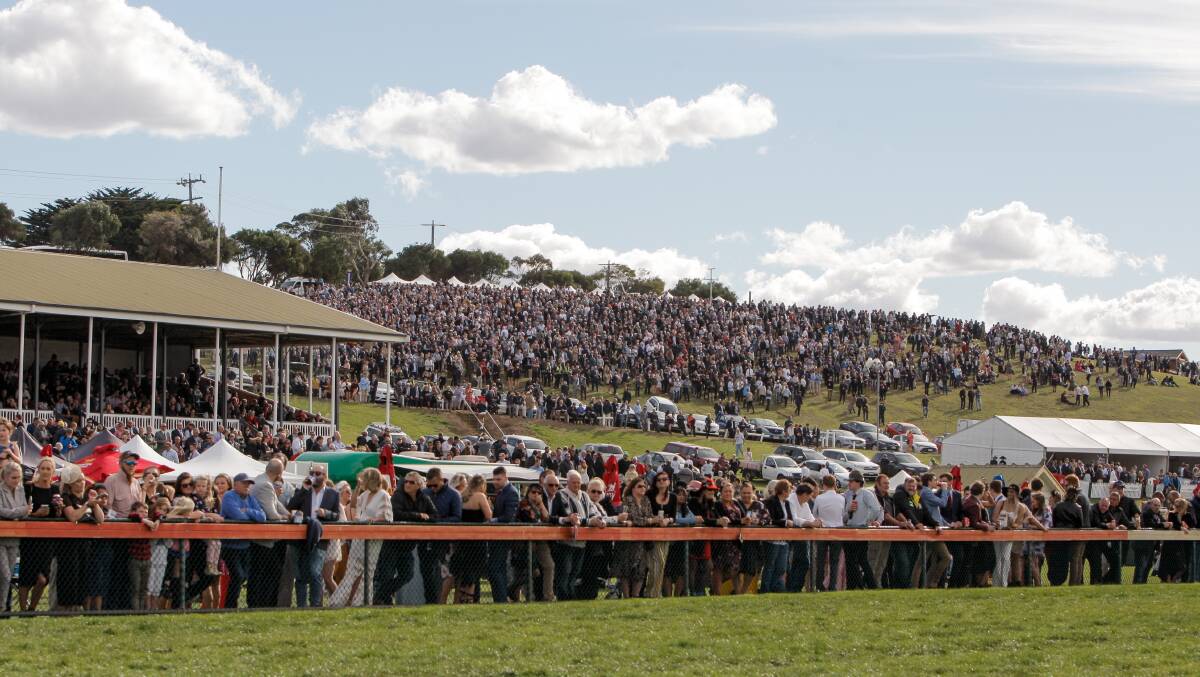 PACKED COURSE: A massive crowd fills the hill at Warrnambool Racecourse to watch the Grand Annual. Picture: Rob Gunstone