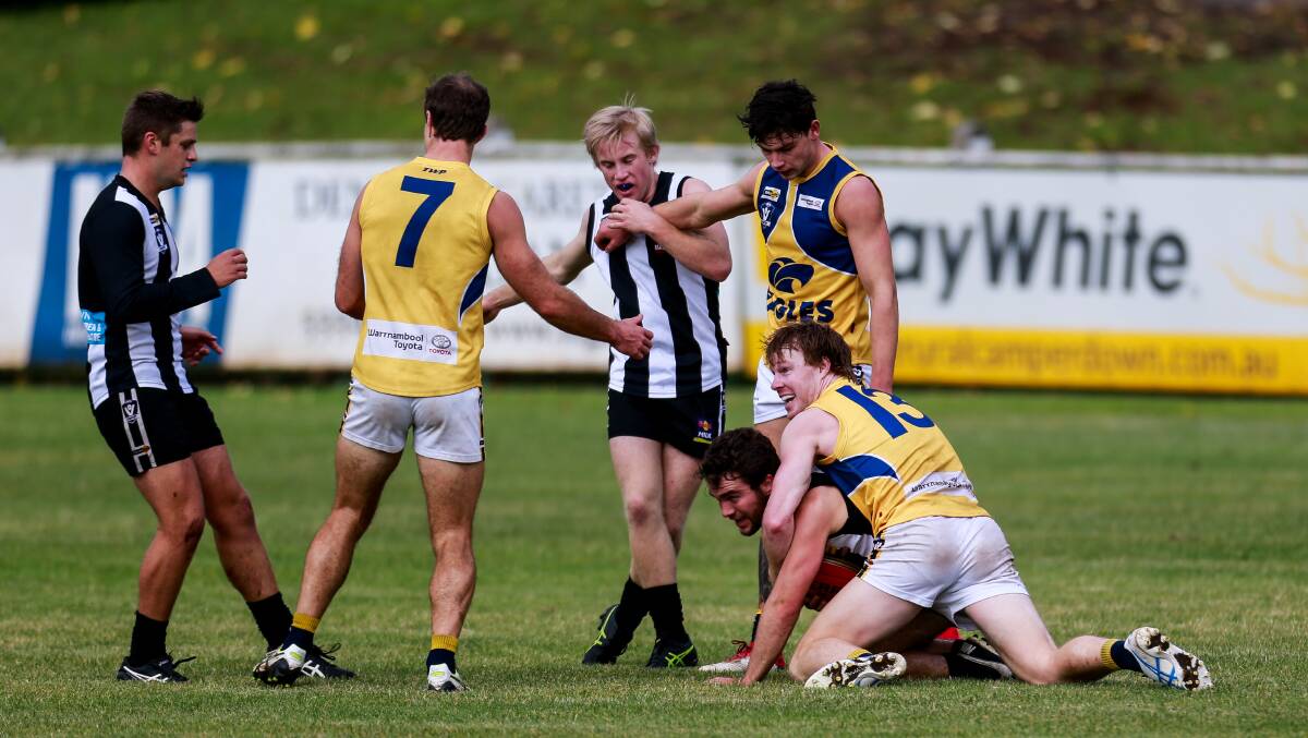 GOT HIM: North Warrnambool Eagles' Adam Wines (number 13) lays a tackle against Camperdown. Picture: Anthony Brady