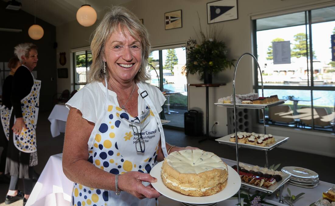 SERVED: Frances Dalton brings out the cake at Port Fairy's Biggest Morning Tea. Picture: Christine Ansorge