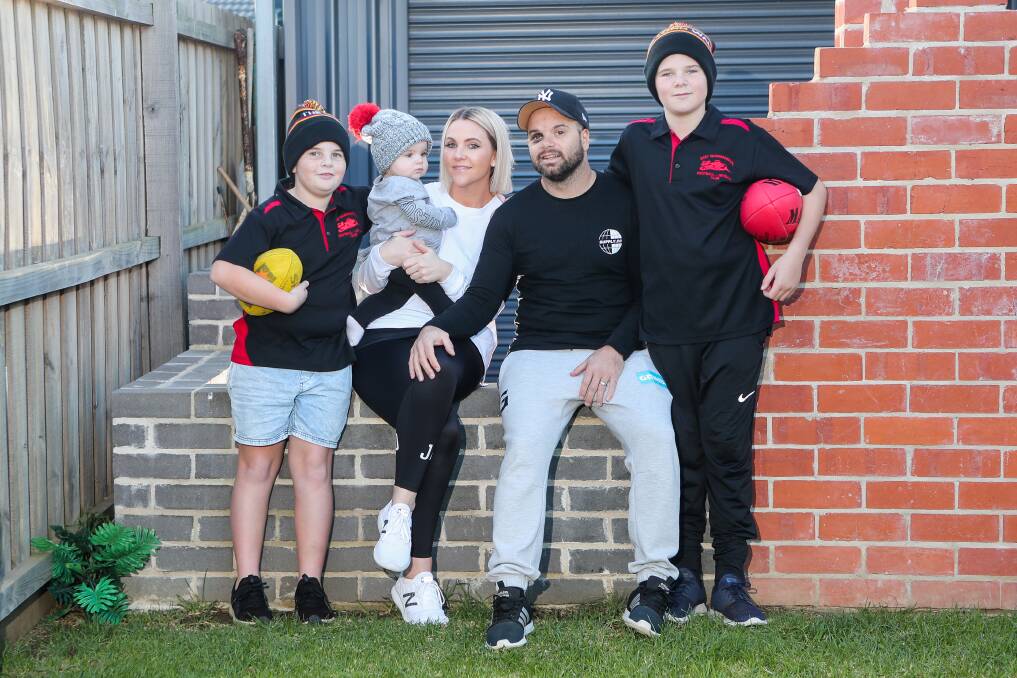 TOP PRIORITY: Kobi Chatfield, Vann Chatfield, Amy Chatfield, Danny Chatfield and Jyah Chatfield at their Warrnambool home after the East Warrnambool coach returned from hospital. Picture: Morgan Hancock