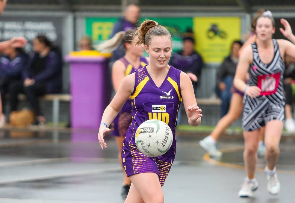 RUNNING AWAY: Port Fairy's Ava Pierce prepares to take posession of the ball. Picture: Morgan Hancock