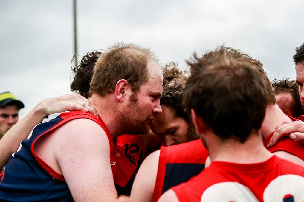 Pep talk: Timboon Demons playing-coach Marcus Hickey gives his side a rev-up during the game. Picture: Anthony Brady