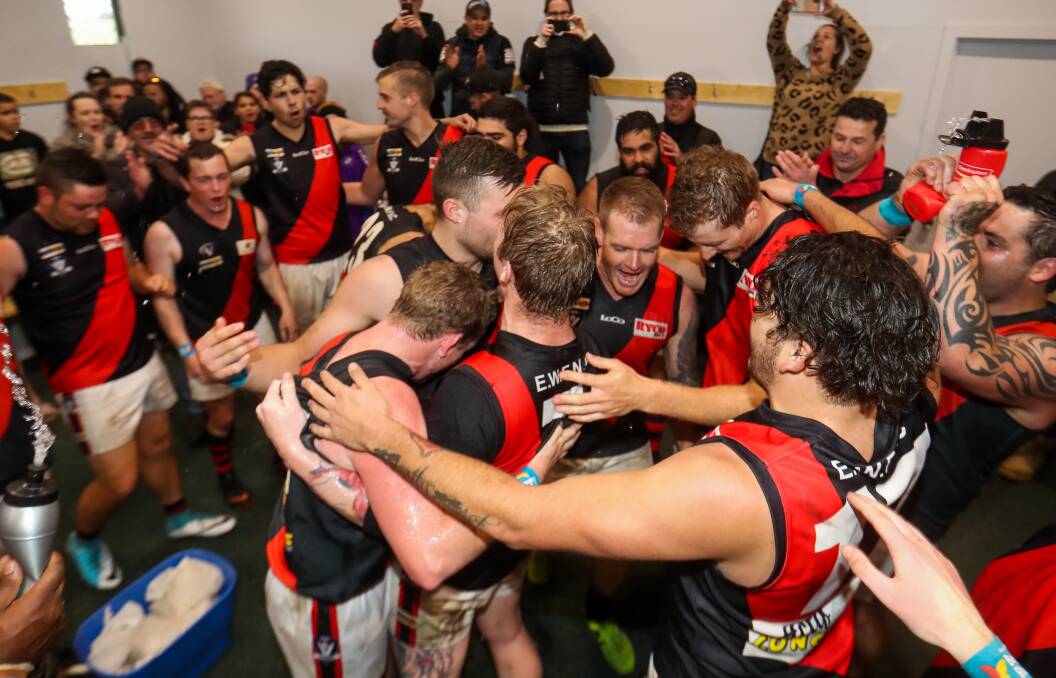 UNCERTAIN FUTURE: East Warrnambool players celebrate a win last season. The Bombers are facing a two-year recess from on-field action. Picture: Morgan Hancock