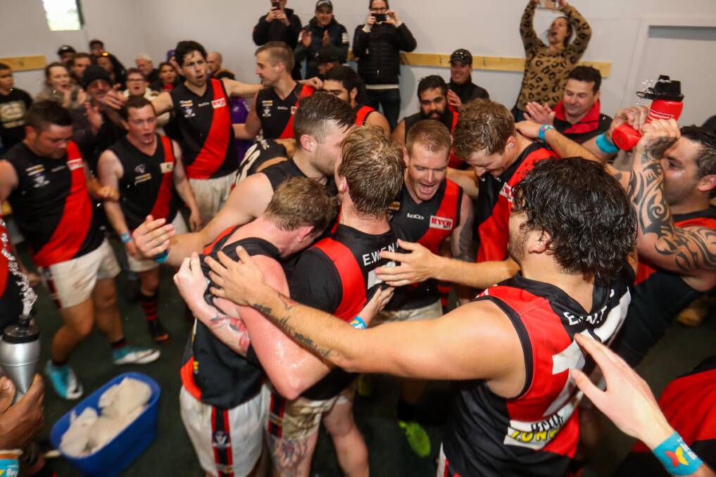 Savouring the moment: East Warrnambool players celebrate their win Dennington after staring down a third-quarter challenge from the Dogs. Picture: Morgan Hancock