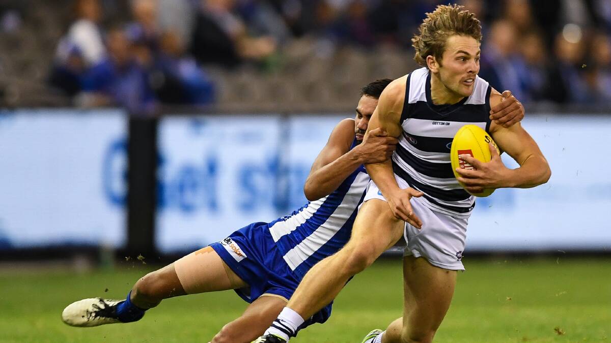 "BALL!": North Melbourne's Tarryn Thomas catches Geelong's Tom Atkins. Picture: Morgan Hancock