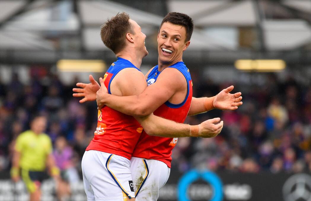Signed on: Brisbane Lions' Hugh McCluggage (right) celebrates a goal with Alex Witherden during a match between the Western Bulldogs and the Lions at Mars Stadium. Picture: Adam Trafford/Ballarat Courier