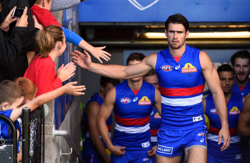 Mentor: Western Bulldogs captain Easton Wood leads his team up the race during the AFL JLT Community Series match between the Western Bulldogs and the St Kilda at Ballarat this year. Picture: Adam Trafford/Ballarat Courier