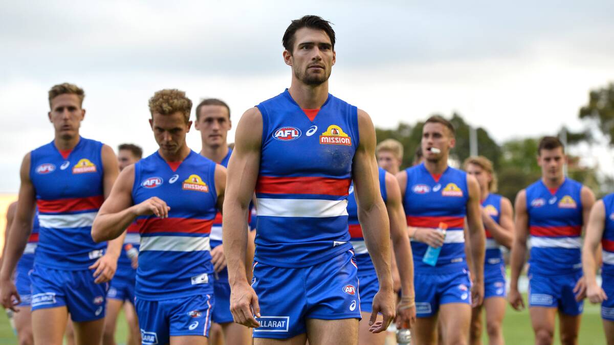 TOUGH TIMES: Gnotuk's Easton Wood leads the Western Bulldogs from the field. Picture: Adam Trafford