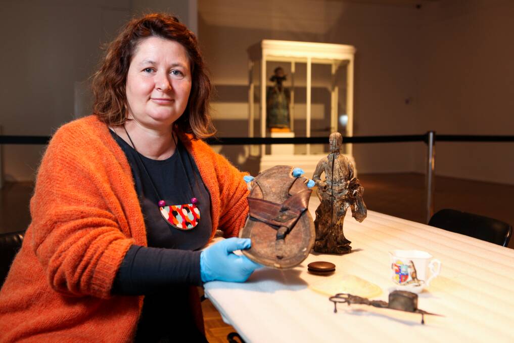 If the sandal fits: Warrnambool Art Gallery curator Agostina Hawkins with some of the more unusual objects in the Museum Collection that will go on display.