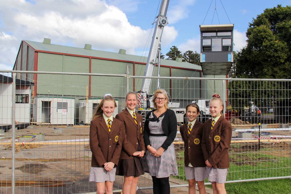 NEW CLASSROOMS: School captains Maddi Flynn, Renae Mauriks, Cate Robson and Maya Van Der Starre, with acting principal Tonya Ferguson, check out the construction of a new classroom at Warrnambool Primary School. Picture: Jackson Graham
