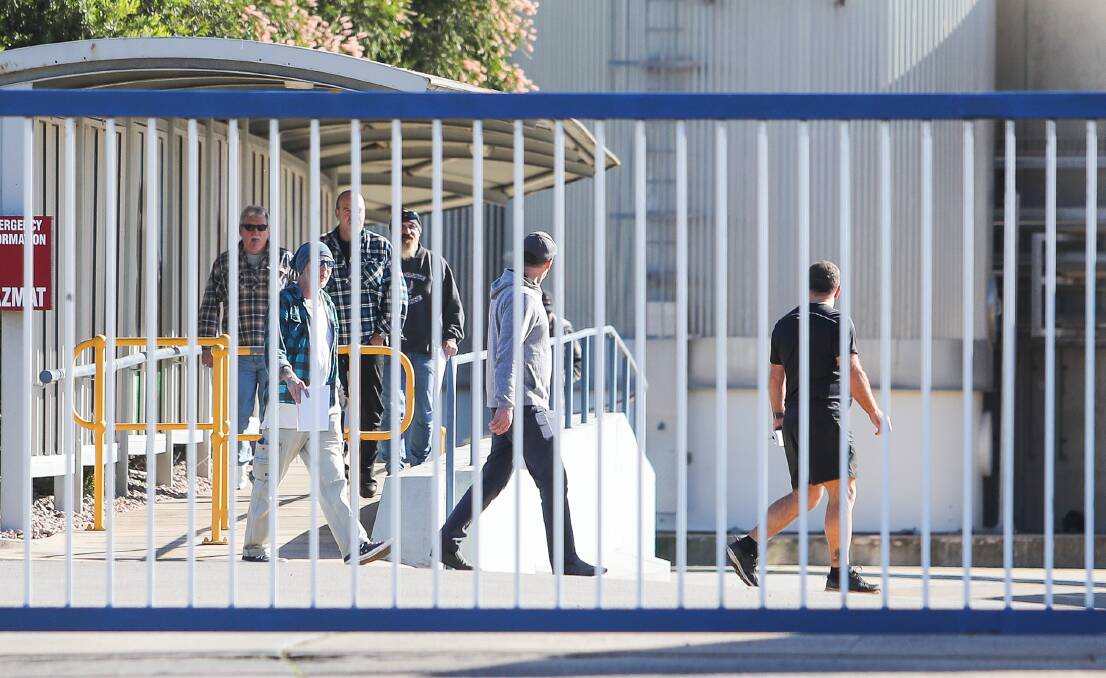 END OF AN ERA: Workers emerge from a meeting after Fonterra announced that it will shut down its Dennington base in November. Picture: Morgan Hancock