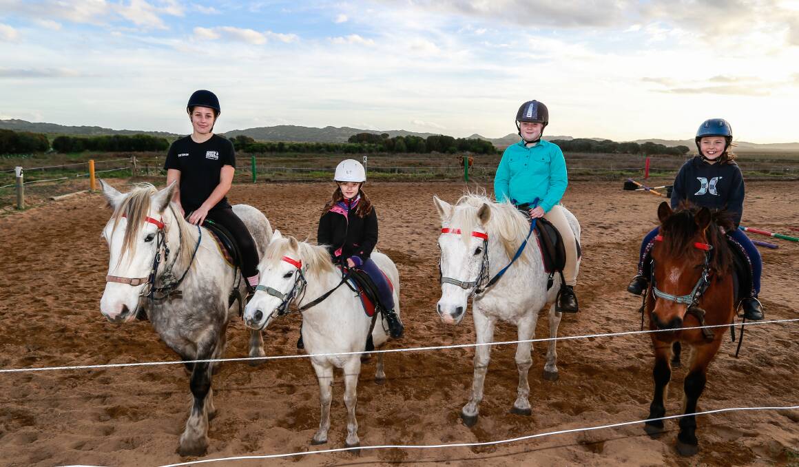 ALL SMILES: Charlotte Farley, Hannah Wilson, Lani Gibson and Yvette Boyle enjoy their classes at Rundells Trail Rides. Picture: Anthony Brady
