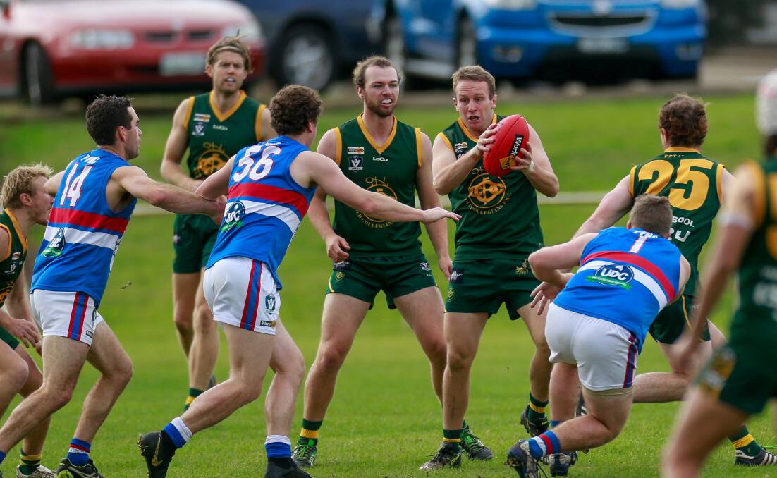 Heavy traffic: Old Collegians' Josh Dwyer contributed well in his team's round eight win over Panmure. Picture: Anthony Brady