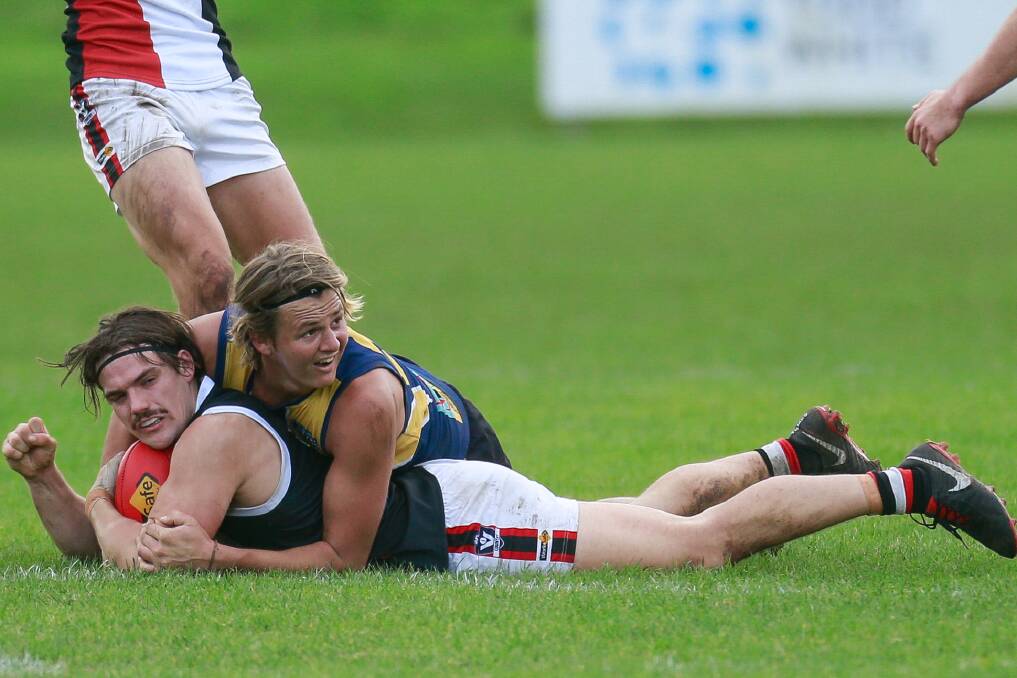 Gotcha: Sam McLachlan tackles James Gow during North Warrnambool Eagles' six-point win over Koroit.Picture: Anthony Brady