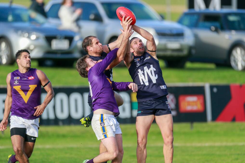 Safe hands: Travis Graham takes a grab on his way to booting three goals against Port Fairy at Reid Oval. Picture: Anthony Brady