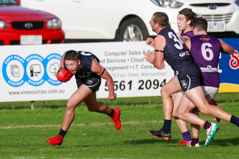 Too fast: Warrnambool's Mitch Burgess gets away during the Blues' 29-point win at Reid Oval. Picture: Anthony Brady
