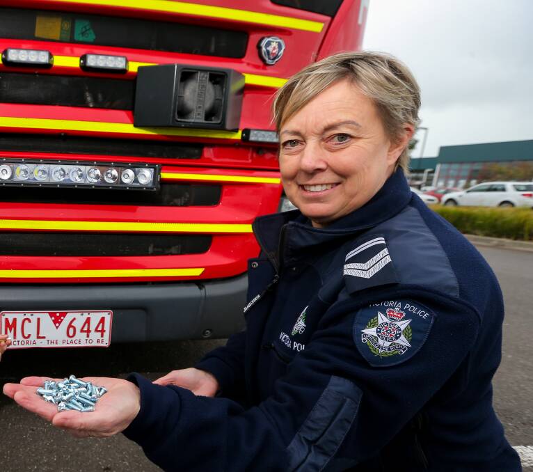 Safe Plate Day: Warrnambool police Senior Constable Trudy Moreland with the number plate screws during a similar day earlier this year. Picture: Rob Gunstone