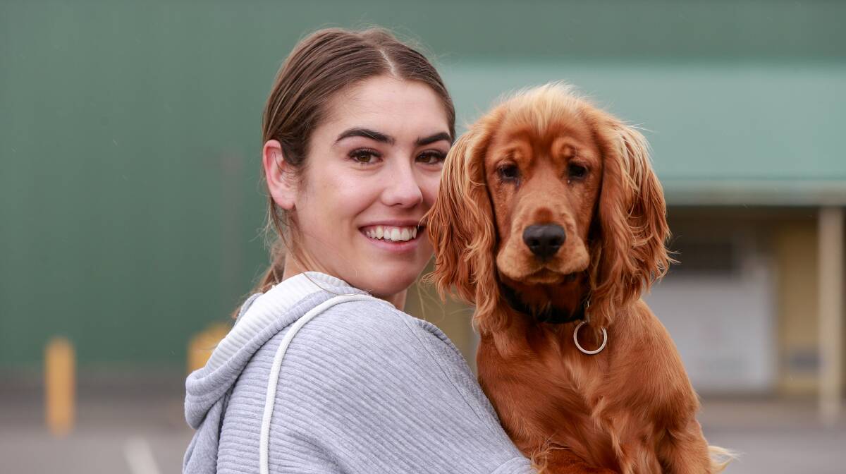 NEW MATE: Injured South Warrnambool netballer Ally O'Connor with her dog Rumi who has helped her through a tough period. Picture: Anthony Brady 
