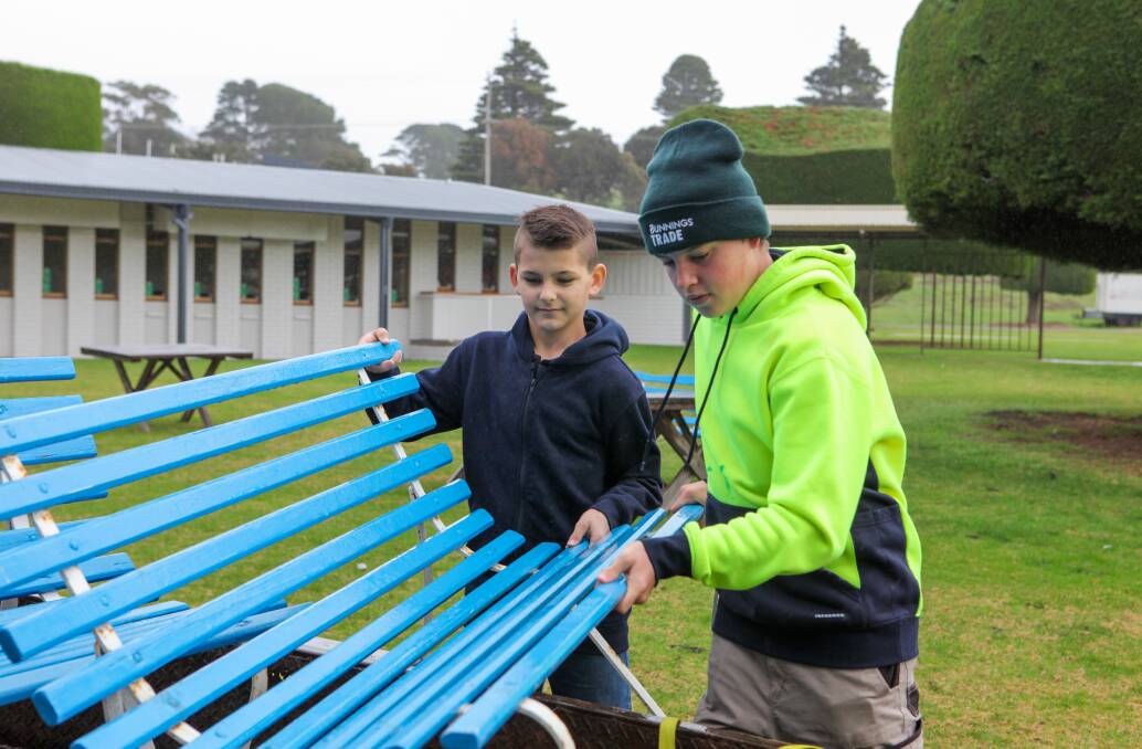 NEXT LOT TO FIX UP: Warrnambool SDS Hands on Learning students help to load up more benches to be refurbished.