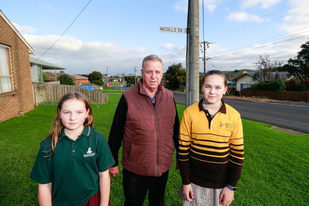 CONCERNS: Dennington Community Association president John Harris and students Stephanie and Sophie Grist want a footpath in Rooneys Road. Picture: Anthony Brady