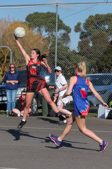 STRETCH: Cobden's Amy Hammond launches to gather the ball against Terang Mortlake on Saturday. Picture: Rob Gunstone