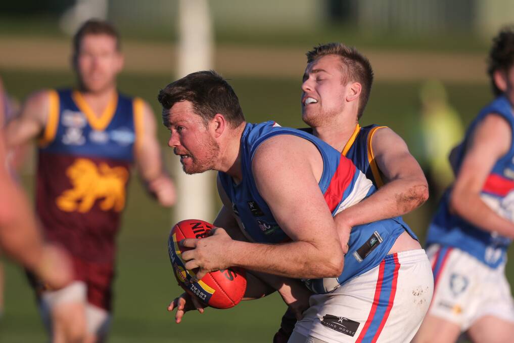 Leading by example Panmure coach Chris Bant marks in front of South Rovers Luke Ryan. Picture: Rob Gunstone