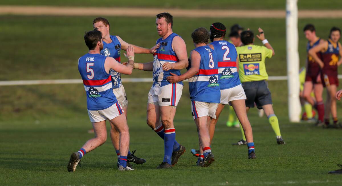 COACH LEADS THE WAY: Panmure players get around Chris Bant after he kicks a goal in the Bulldogs' win over South Rovers at Mack Oval. Picture: Rob Gunstone