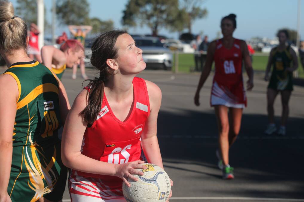 Sharp shooter: Dennington's Zoe Fleming eyes the goals during her side's one-goal win over Old Collegians. Picture: Gus McCubbing