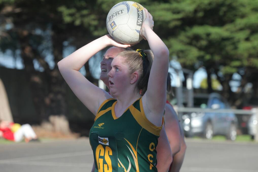 Dangerous: Chelsea Quinn takes a shot for during Old Collegians' one-goal loss to Dennington. Picture: Gus McCubbing