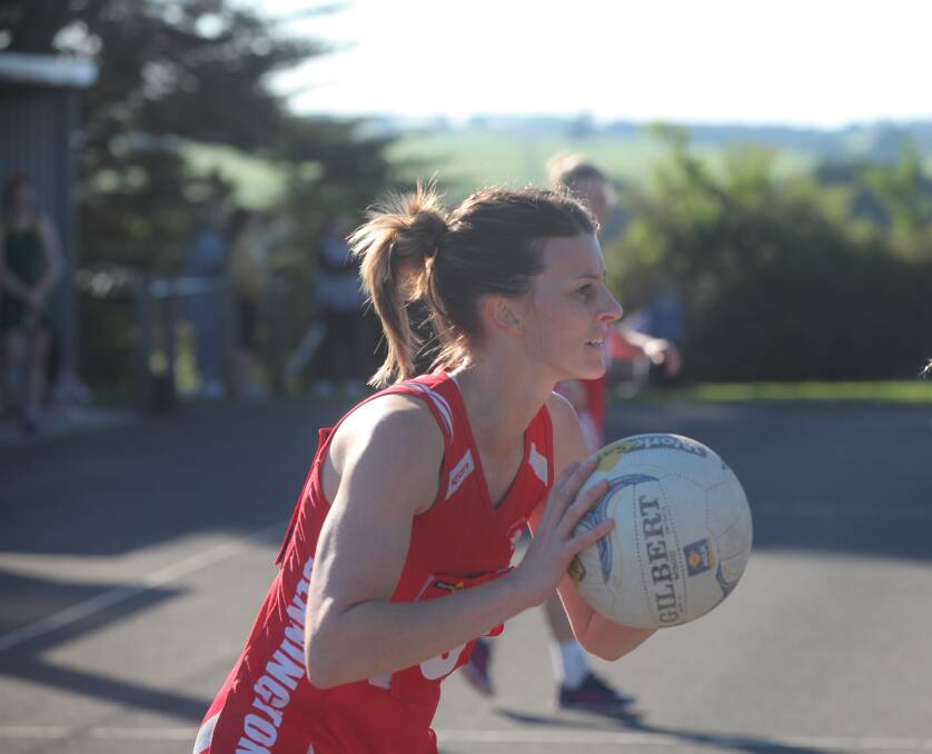 Midcourt duel: Dennington's Angela Northcott looks feed into the ring. Picture: Gus McCubbing