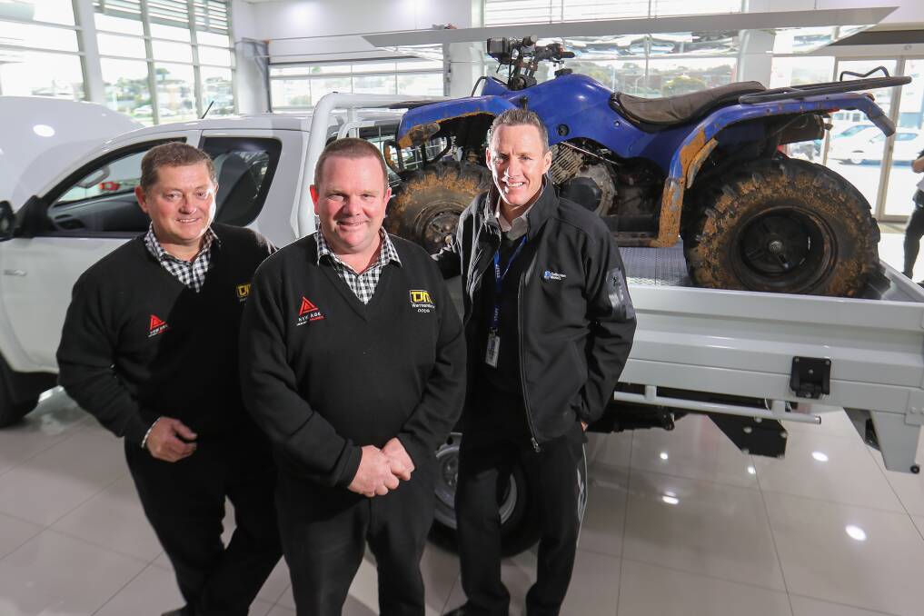 EVER GROWING: Brett Jones, Doug Marshall and Steve Callaghan pose with a quad bike on the Callaghan Motors showroom. Picture: Morgan Hancock